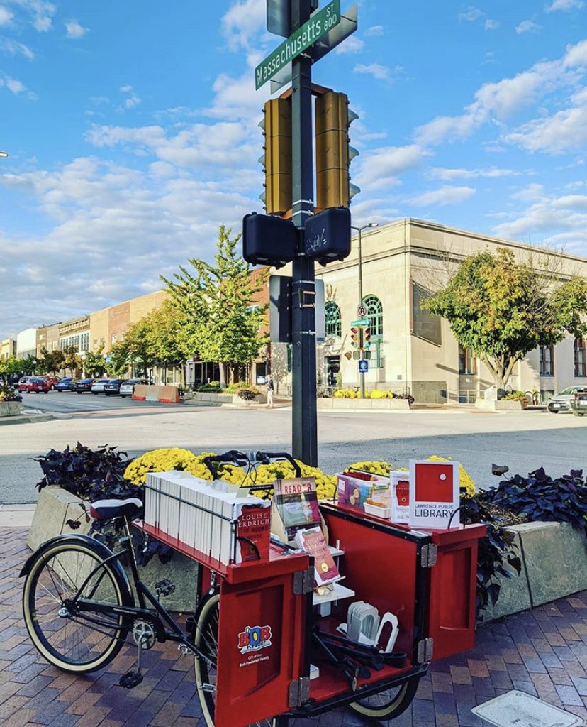 lawrencelibrary's tweet photo. We’re out at 8th & Mass until 7pm with Bob’s Book Bike and copies of THE ROUND HOUSE. Come say hello and grab a copy! #RAL2020 https://t.co/mI7hrLvfcN