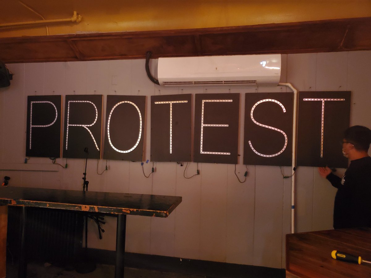 JosephBrusky's tweet photo. Bittersweet moment pulling down @OLBLightBrigade PROTEST lights from @RWPublicHouse walls where they've been since '17. Bar is open through next weekend &amp; am told conversations about future still happening. @VDLF_Action new office will be new home for the lights. #fightwithlight https://t.co/7R6CHTUQIh
