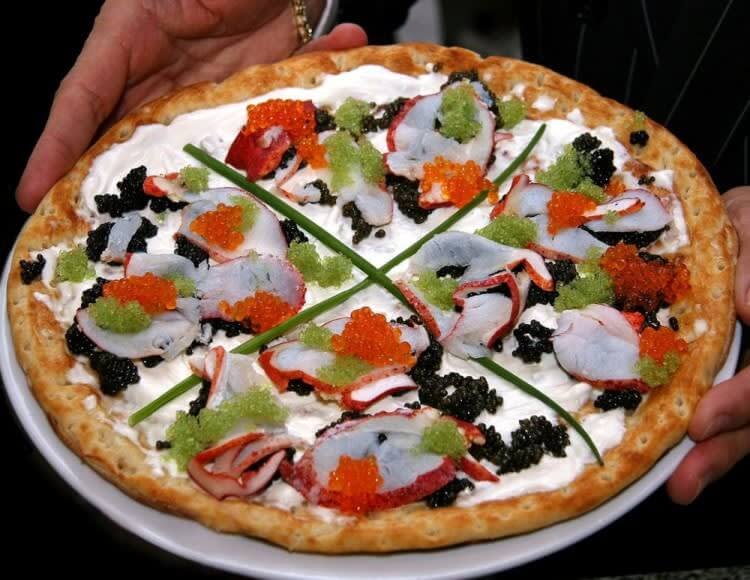 In a mood for pizza? 🍕But not JUST pizza... The 'Louis XIII Pizza' dish costs $12,000 and is the priciest pizza in the world. The special dough takes 72 hours to rise before it is baked and is served with three different unique types of caviar 😱