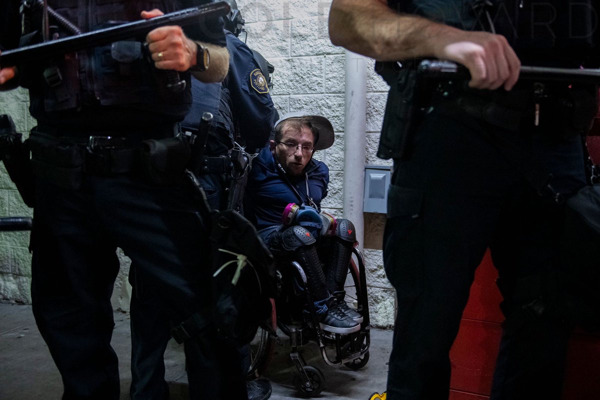 This morning PPB arrested this protester. Two nights earlier a LE officer told him "I don't care if you are in a wheelchair, if you speak again I will knock you out." It is unknown if these two incidents have any correlation. #Portland #PortlandProtests #PDX 
9/29/2020