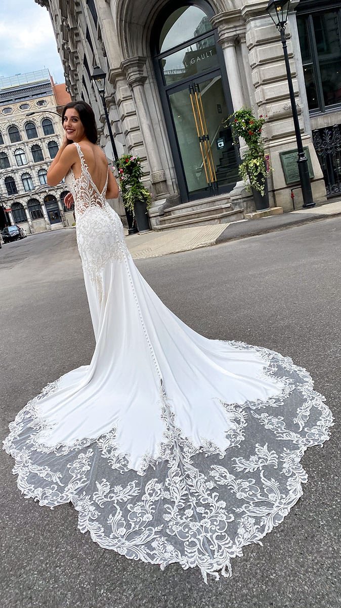BuyBridal's tweet photo. Don’t forget our SKY by Eddy K trunk show this weekend! We still have available appointments Oct 2-3! This beautiful gown is Elisa, and she is a crepe wedding dress with beaded embroidery and buttons along the train that is a must for you to try on! 🤩 Call to schedule an appt! https://t.co/5jvFAIWIiG