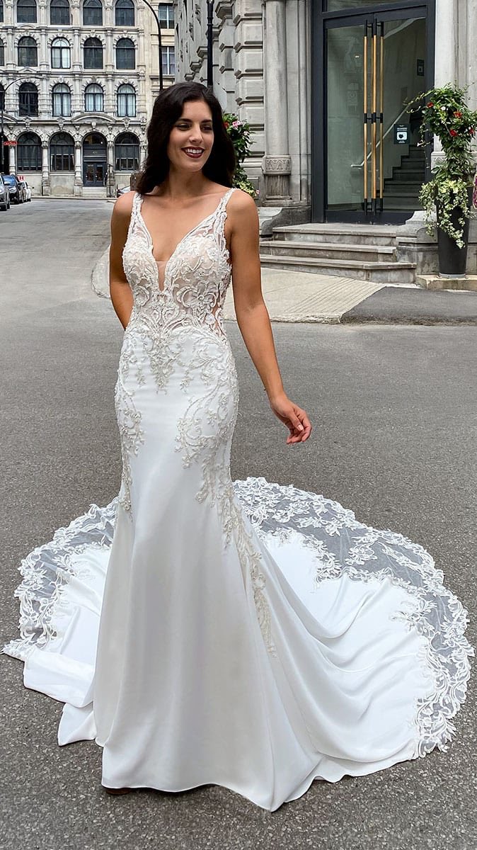 BuyBridal's tweet photo. Don’t forget our SKY by Eddy K trunk show this weekend! We still have available appointments Oct 2-3! This beautiful gown is Elisa, and she is a crepe wedding dress with beaded embroidery and buttons along the train that is a must for you to try on! 🤩 Call to schedule an appt! https://t.co/5jvFAIWIiG