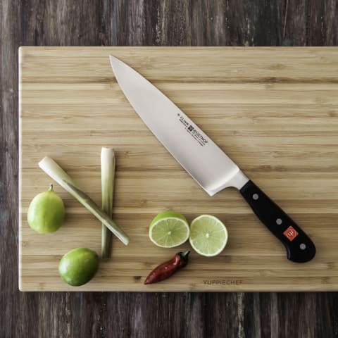 "Chef's Knife". The most common knife associated with chefs. Even named after the profession. We use it the most and its the one we refuse to loan to others. You want it to have a sturdy handle and to be well balanced.