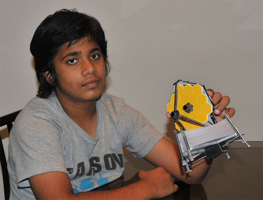 Student Siddharth Balakrishnan holds up his Webb model.