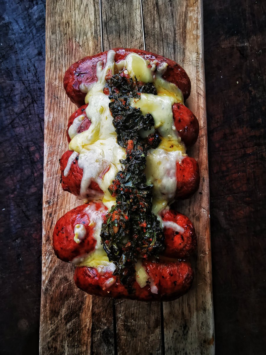 devonwoodsmoke's tweet photo. Gorgeous Argentine style chorizo cooked simply on a v grill are so delicious, especially when topped off with melted cheese and chimichurri ... Love this firepit grill perfect for a spot of autumnal cooking over apple wood #ukbbq #bq #firecook #livefire #firepit #outdoorcooking https://t.co/KNgqA7olJV