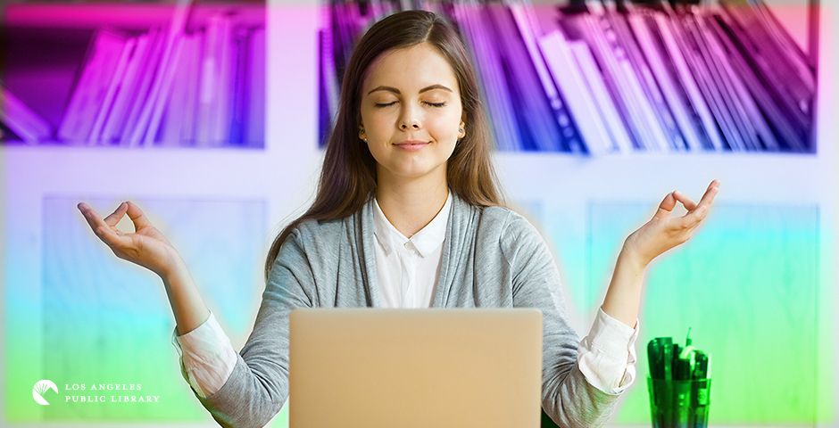 young girl meditating in front of laptop