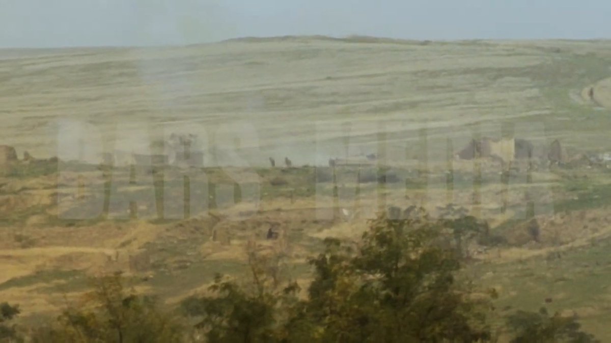 Screenshots showing a destroyed Armenian tank and Azerbaijani soldiers from Nagorno-Karabakh forces' fighting positions. 317/