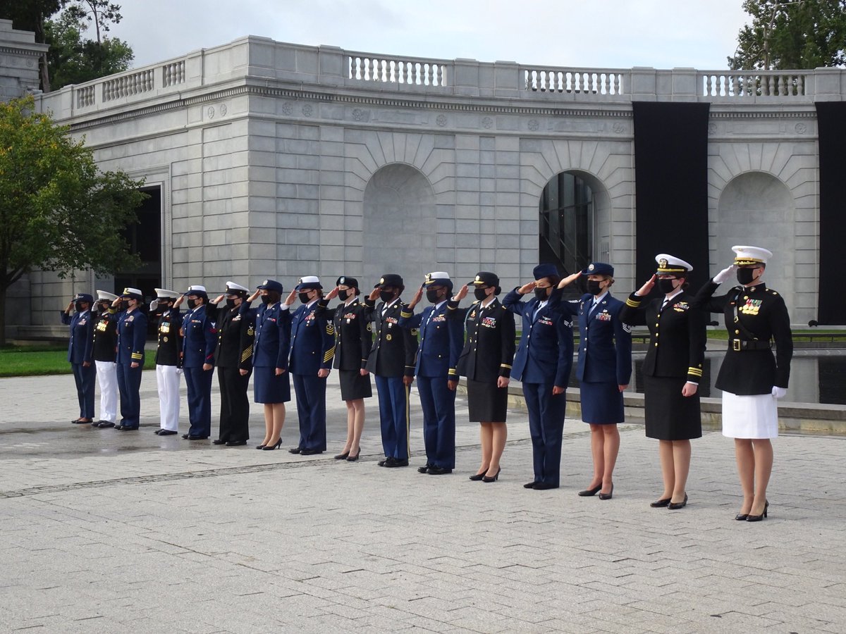 Women from the Army, Navy, Marine Corps, Air Force, Coast Guard, & Space Force salute #RBG as her remains enter Arlington National Cemetery for burial. They are standing in front of the Memorial For Military Women.