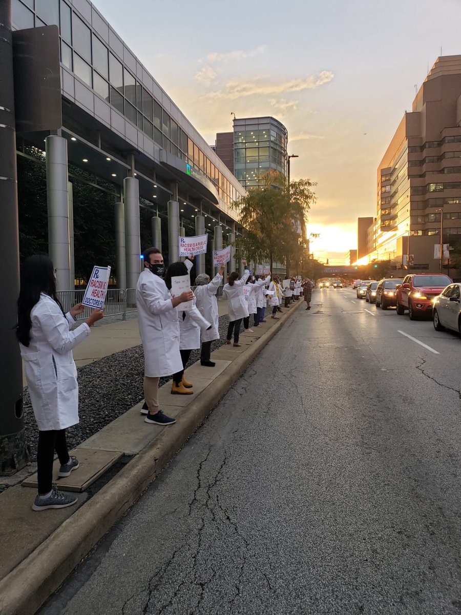 Doctors stretching city blocks at #Debates2020 in #CLE! #healthcareisahumanright #whitecoatsforblacklives #scienceisreal #DocRallyCle #BidenHarris2020