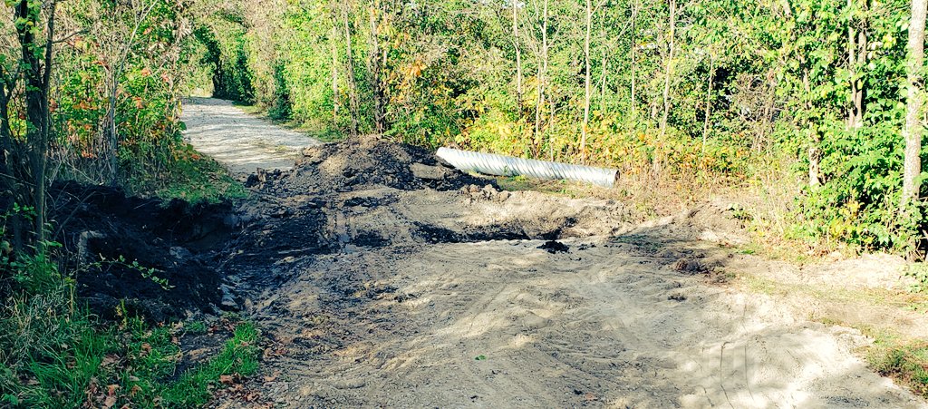 Vve's tweet photo. When the tractor's hydro line bursts in the middle of digging a trench in the driveway...shovels for the win! https://t.co/7maKoxErag
