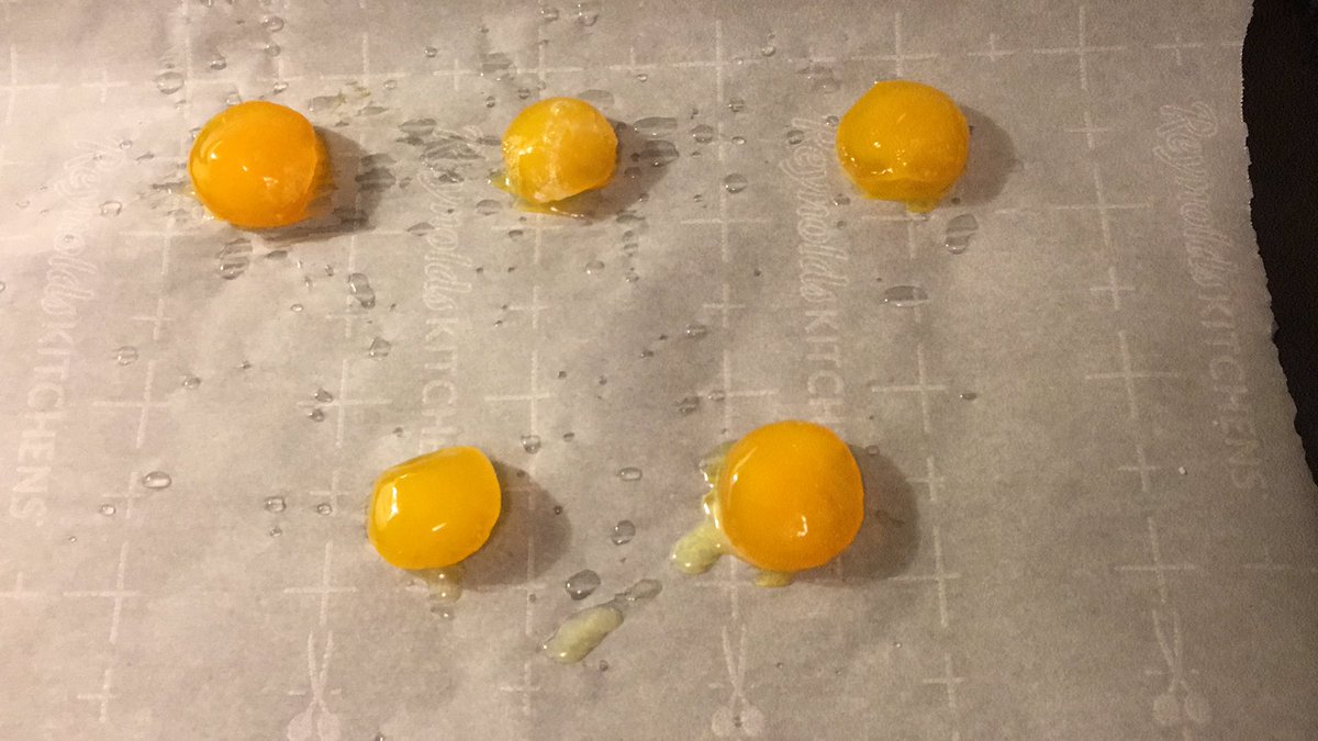 Salt cured egg yolkies going into the oven spritzed with bai jiu for a quick bake