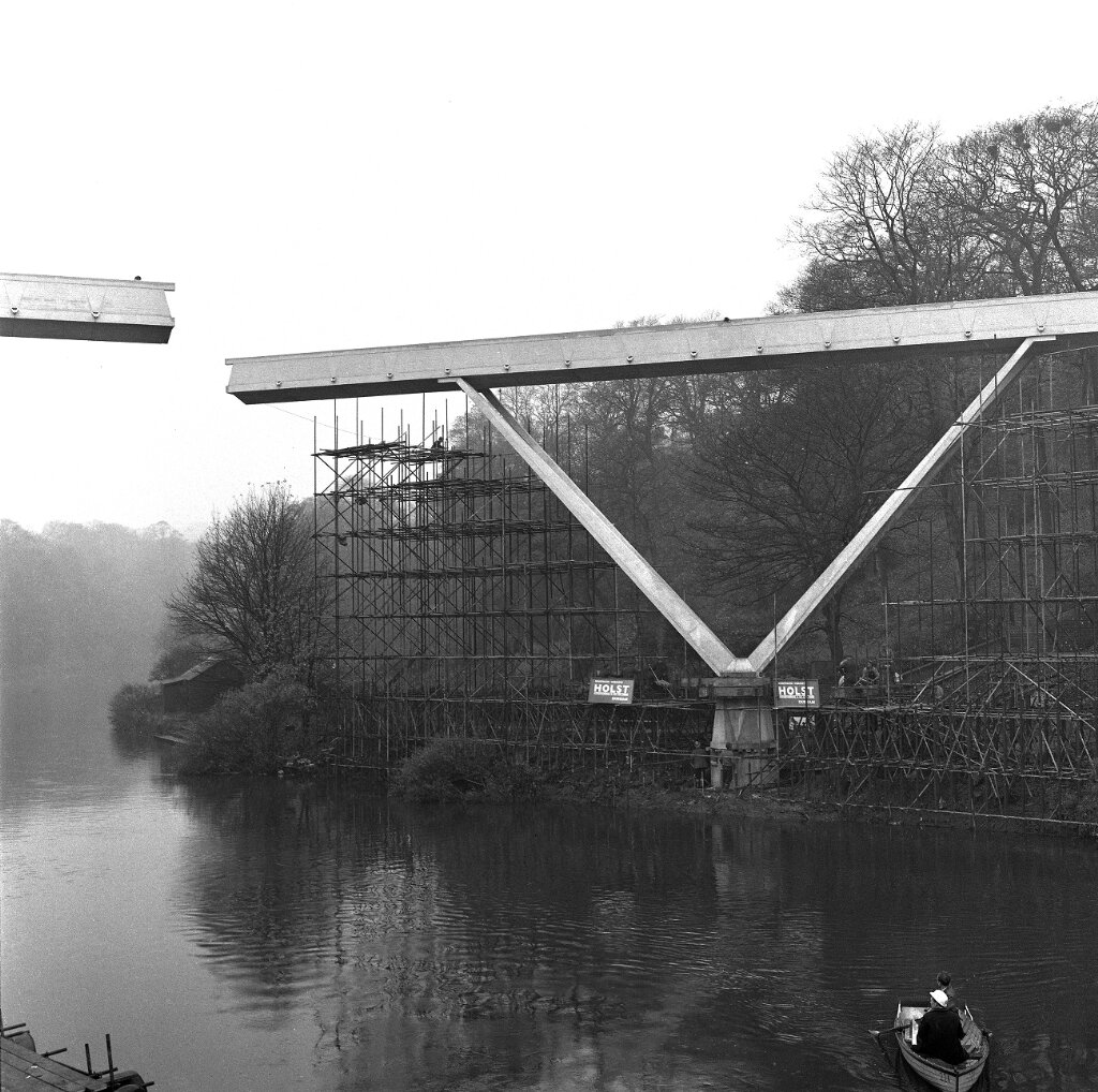 The two halves of the bridge being swung into position.