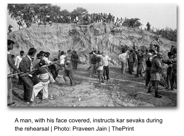 Here is a man, his face covered as is perfectly natural, directing men who happened to have roped with them in a demolition rehearsal unrelated to the totally unplanned mosque collapse hours later: