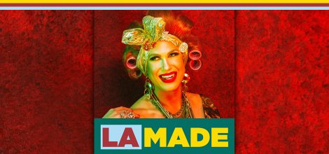 Drag Queen Story Hour's Pickle in front of red background