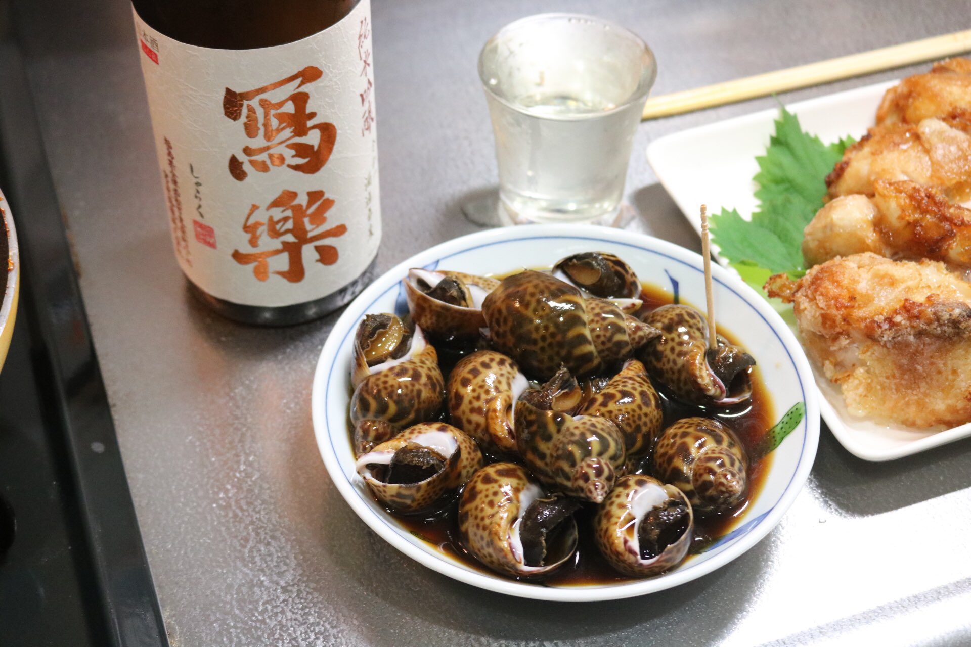 Taipon 晩ごはん バイ貝煮付け かすべのほっぺ唐揚げ 日本酒 乾杯です Taipon 晩ごはん バイ貝煮付け かすべのほっぺ唐揚げ 日本酒 乾杯です
