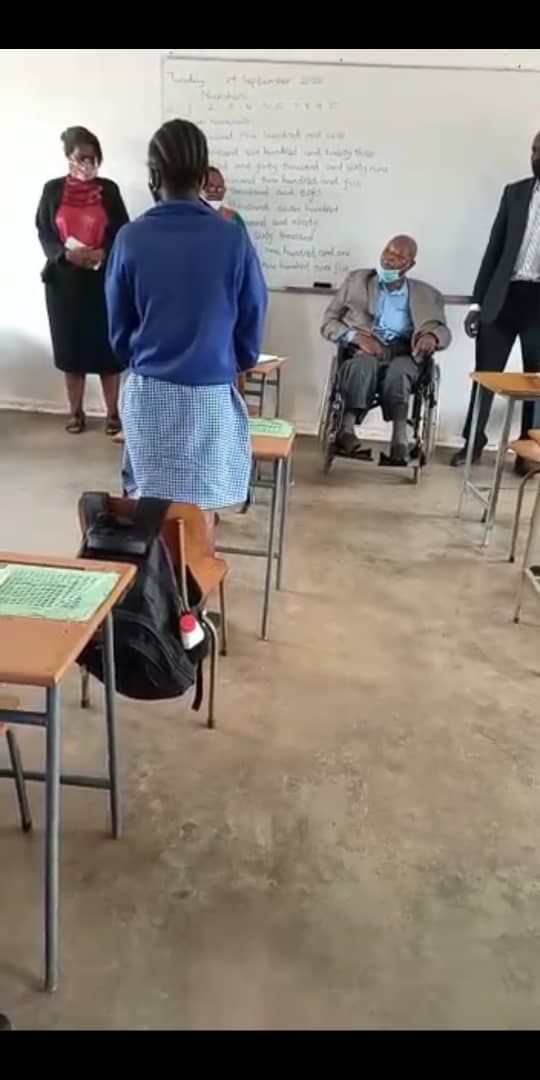 Handing over personal hand sanitisers to students at King George VI. PWDs are a forgotten tribe usually left out of Dvlpt projects and programs. The sanitisers were sourced by the office of the Advisor on National Disability Issues from Ecotourism Africa Trust.