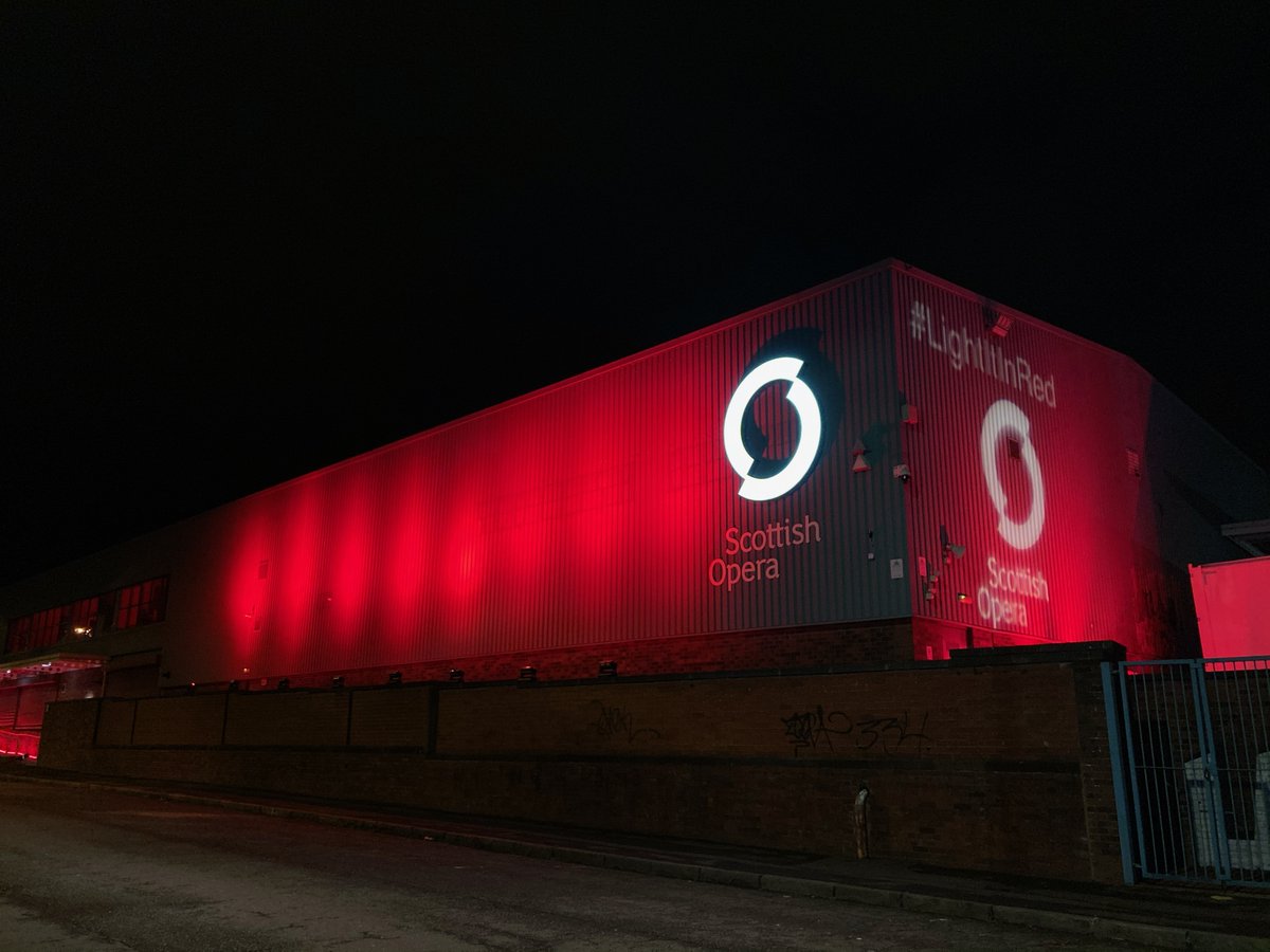 ScottishOpera's tweet photo. Tonight we stand in solidarity with artists across the world who are unable to perform and the 000s in the industry who are facing job losses. A stark reminder of the devastating impact of the pandemic on our industry.  #LightItInRed #wemakeevents #StandAsOne https://t.co/ERsJUE74UM