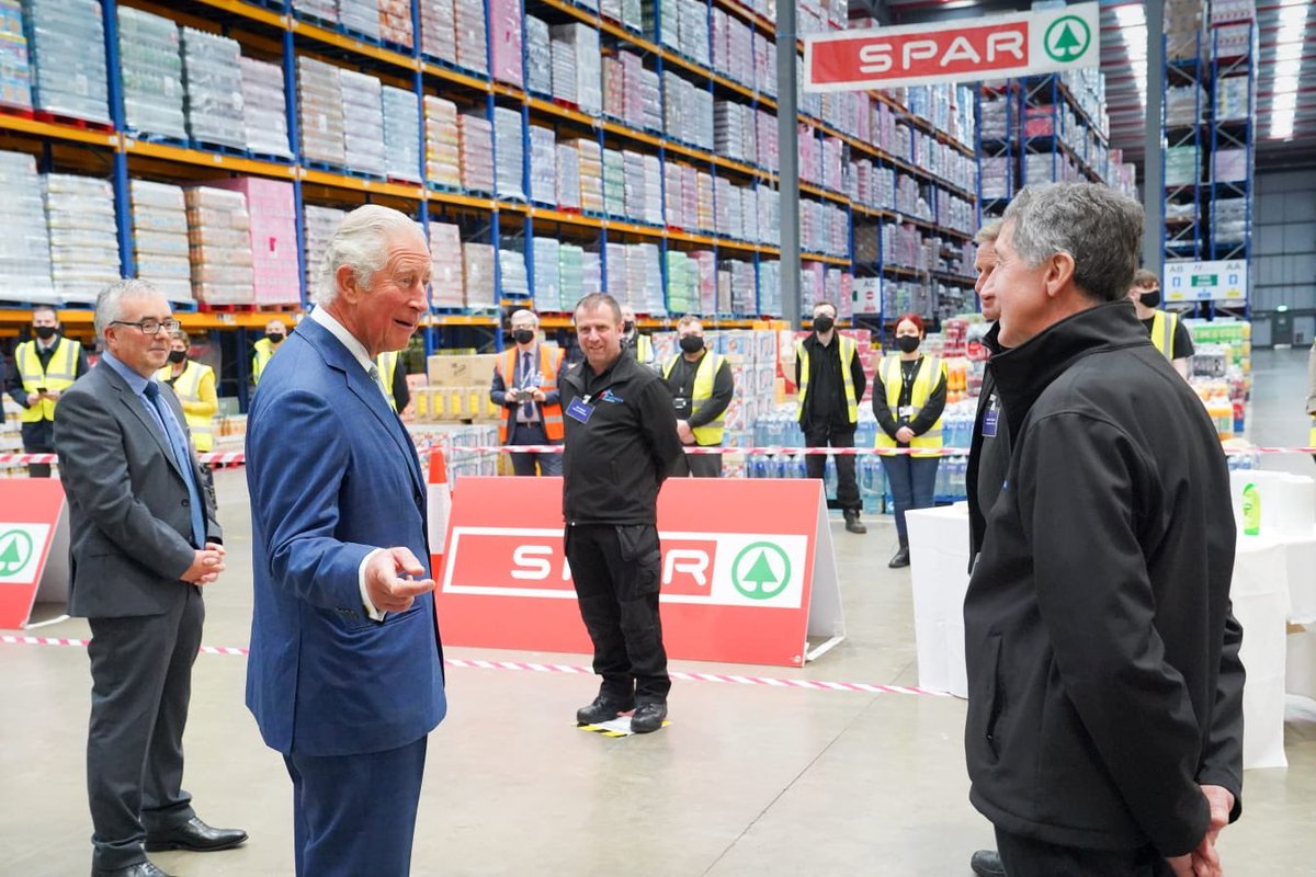 NIOgov's tweet photo. HRH The Prince of Wales met staff @HendersonFoods in County Antrim to hear how the company has maintained food supplies and met unprecedented demand over the past few months during the pandemic. @ClarenceHouse https://t.co/xVhAgXsROB