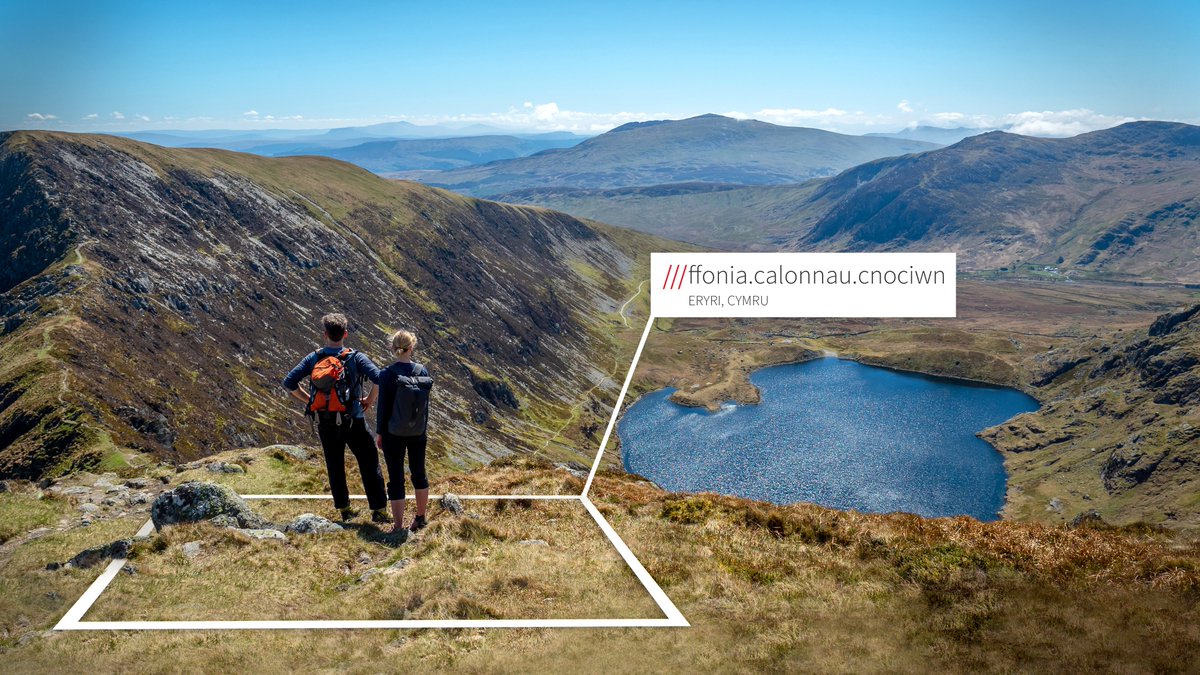 Lake in Wales, surrounded by mountains. what3words address is welsh and reads ///ffonia.calonnau.cnociwn