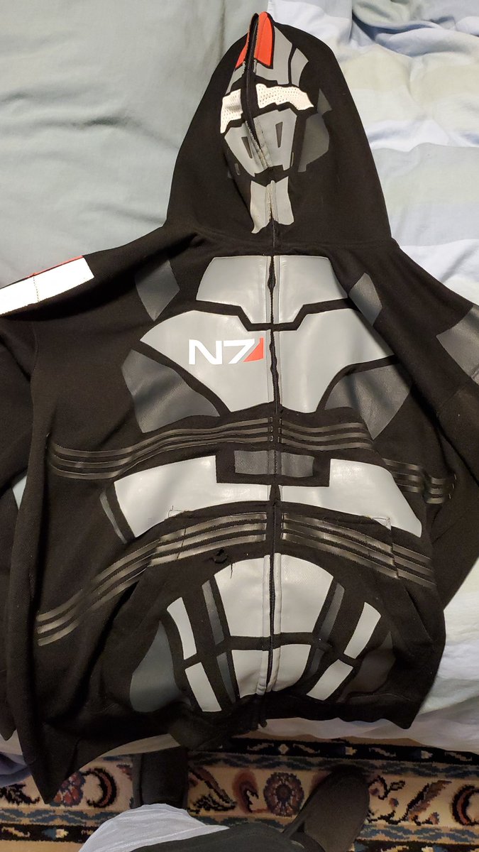 Sympathomimetic's tweet photo. @ShttingGlitter @Quiproquo28 @BiowareGear @bioware @masseffect I didn't know that one even existed!! I looked it up, that looks so cool! I have this one, 10 years old, turns into a Halloween costume lol https://t.co/HA6as5pbRx