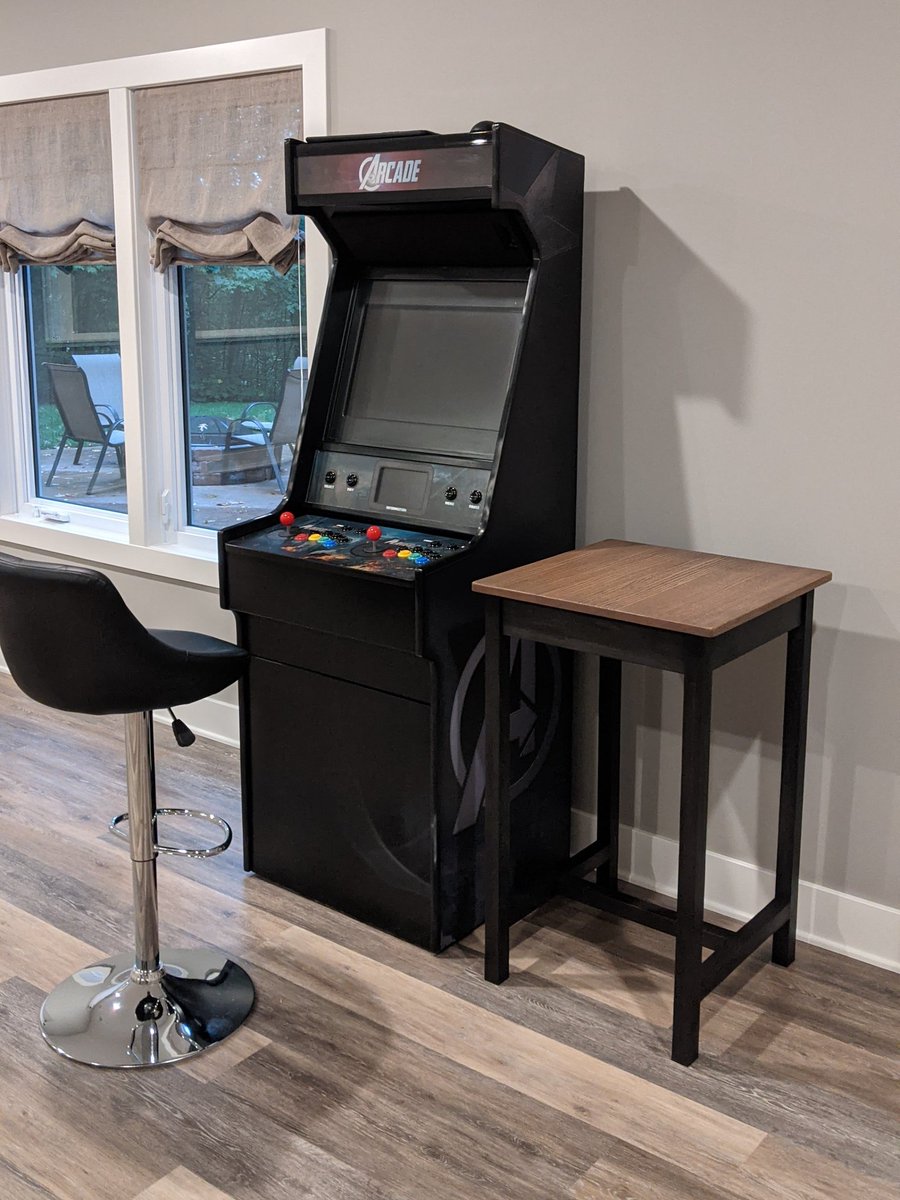 RxBrad's tweet photo. My COVID Project: I made a table (at perfect beer height) to put next to my arcade machine, using nothing but a bunch of 1x4s I picked up from Menards. So, that's pretty cool. https://t.co/eBFCAgS1NC