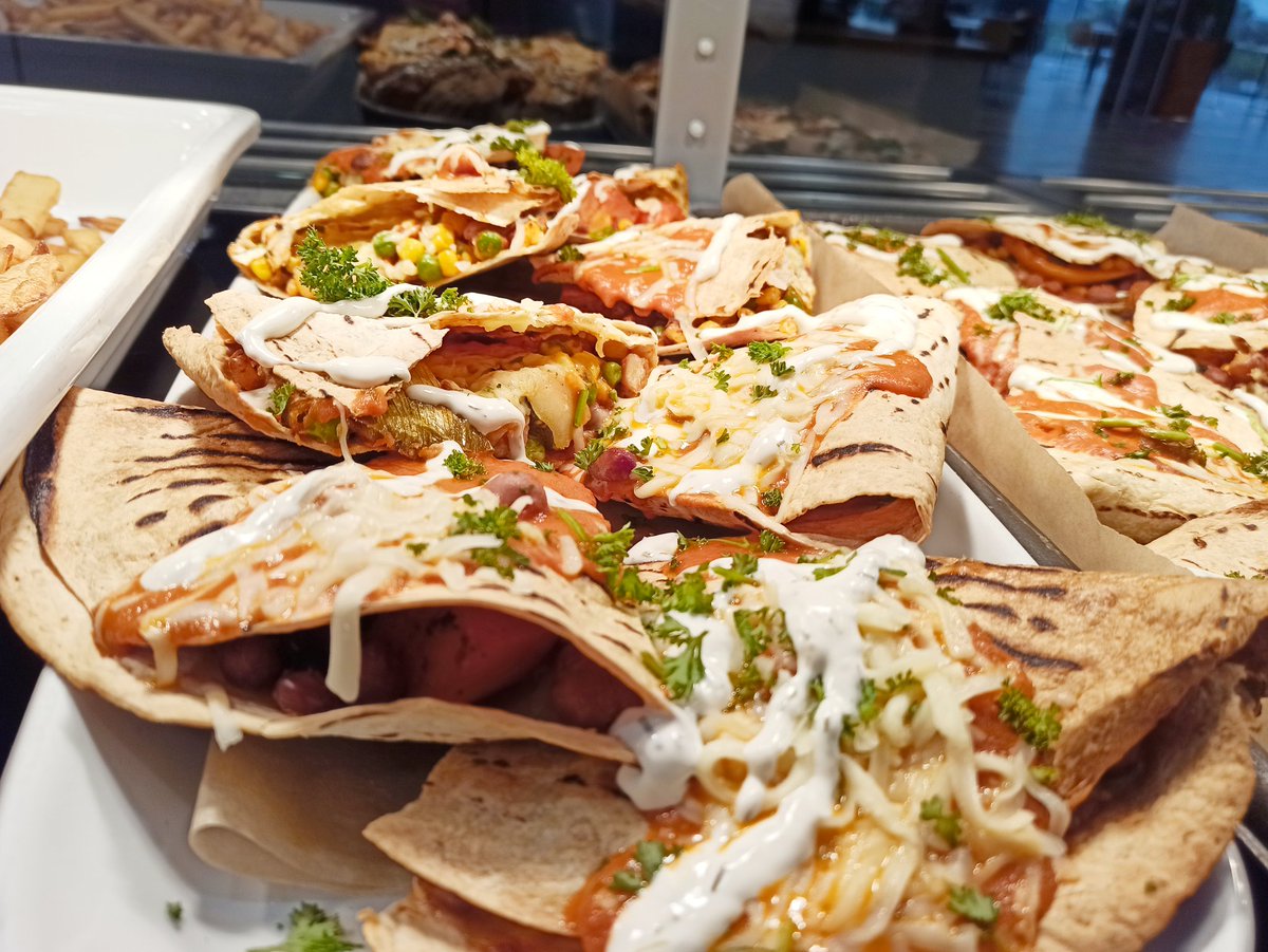 Mexican chicken Gratin with spicy rice, jalapeno bean sauce, Mexican slaw, nachos, soured cream, guacamole and cheese. 
Vegetarian quesadillas at Quayside 😃