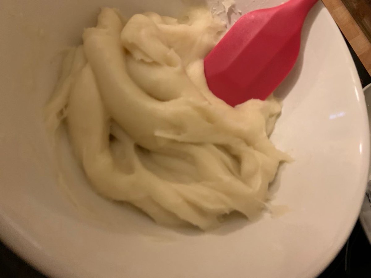 closeups of the snowskin dough as it progresses through the stages of being mixed, microwaved and then kneaded with a spatula until glossythis recipe:  https://www.chinesefoodhistory.org/post/purple-and-white-mooncakes-a-twist-on-an-old-treat-with-a-chocolate-variation
