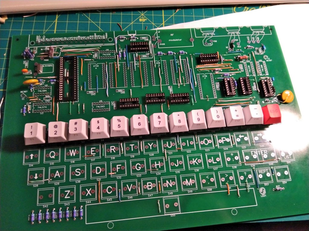 The top row with number keys is soldered! Because the switches are incompatible with the PCB, I'm soldering some wire from CAT cables to make the connection. It seems to work ok.