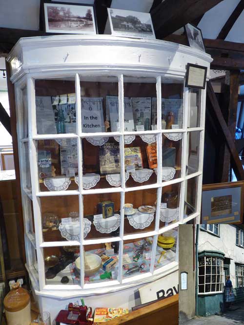 #objectoftheweek This bow window measures 6 feet by 5 feet by 2 feet is one of the feature displays in the Museum. Originally located in Rayleigh High Street in a shop named Kathleen’s Hat and Gown Shop, which can be seen in the small picture inset at the bottom.