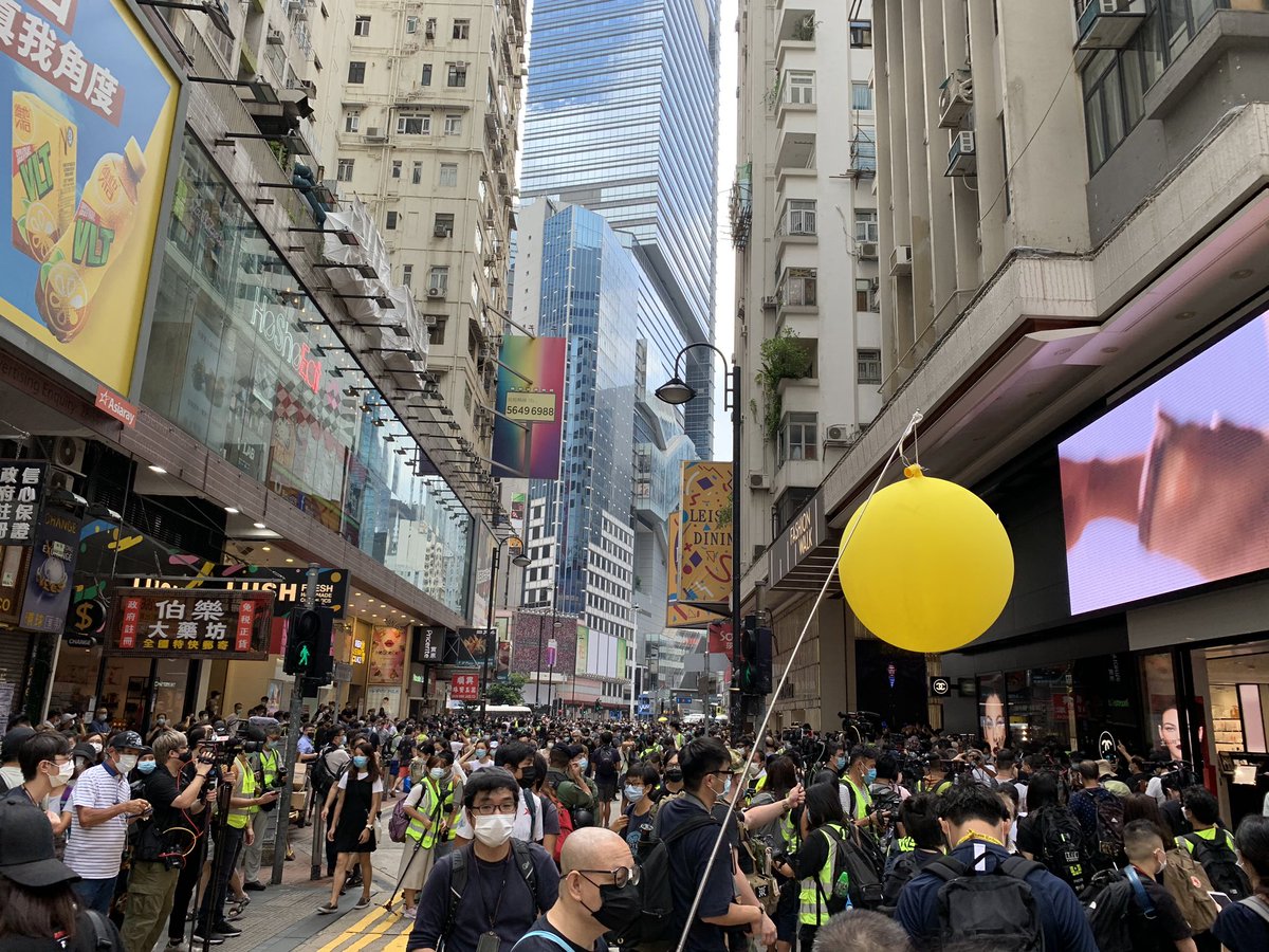 Seditious yellow balloon spotted amongst riot police