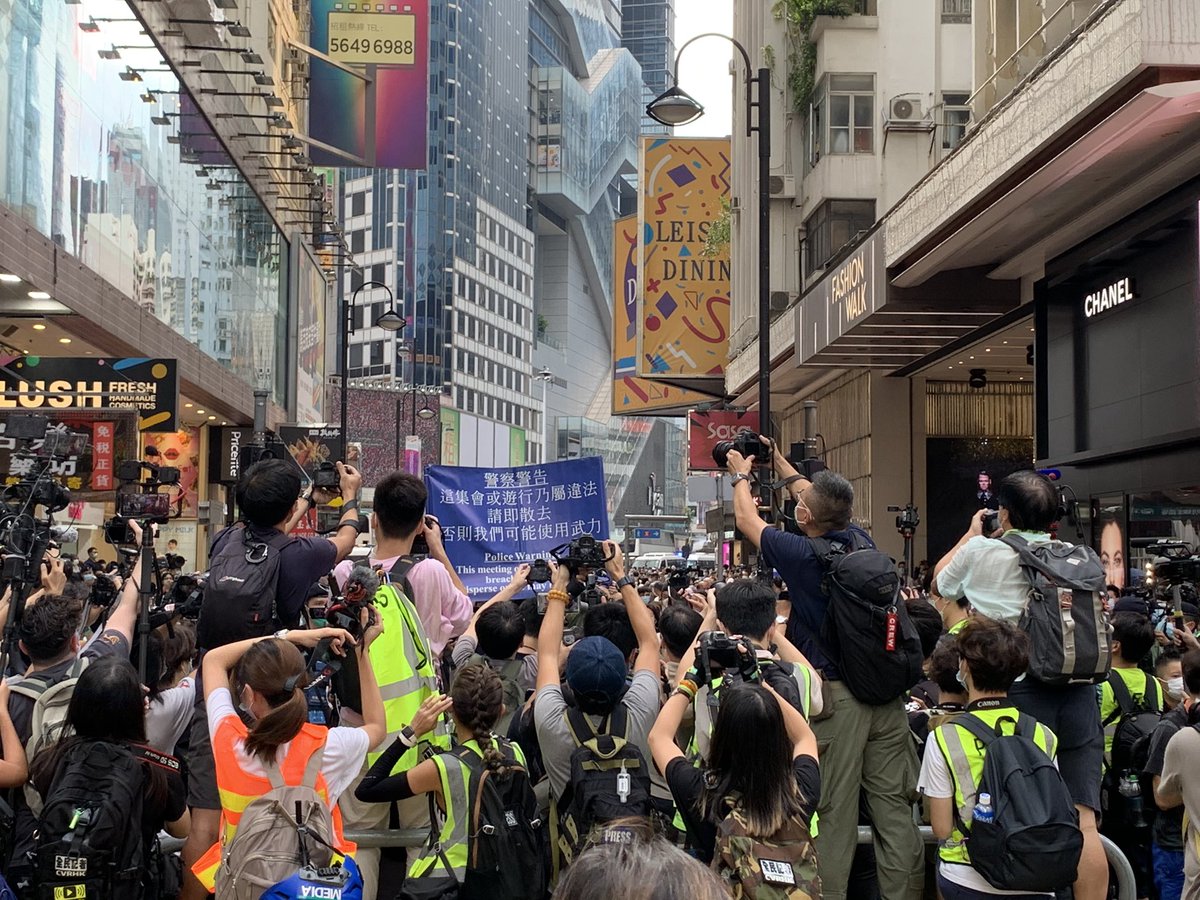 Moments after chants of 'liberate hong kong, revolution of our times' ring out, police raise the blue flag. It's starting. Be careful everyone