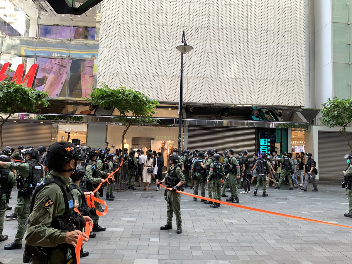 Looks like the one smart guy in the force has devised a clever tiangulated kettling system. Watching from inside Pricerite with a few others. Can't see who they've caught in their net.