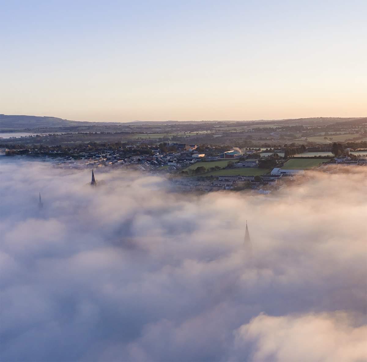 Above the midst New Ross...can you spot the three spires peeking through the heavy fog blanket this morning 😲😲