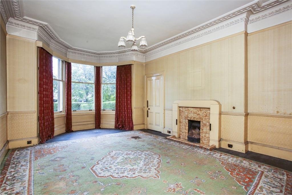 The most modern thing in this room is the 1930s fire surround. Note the traditional floor covering of a large rug, with the floorboards around the edges treated with a dark bituminous stain (which is an absolute *%$($£ to get off)