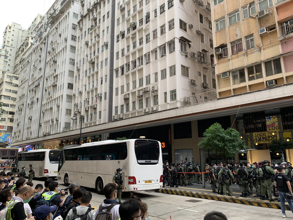 Large number of people kettled by police. Men and women seperated. Two large vans await nearby. Whatever this makes you think of, that's exactly what it is.  #HongKong