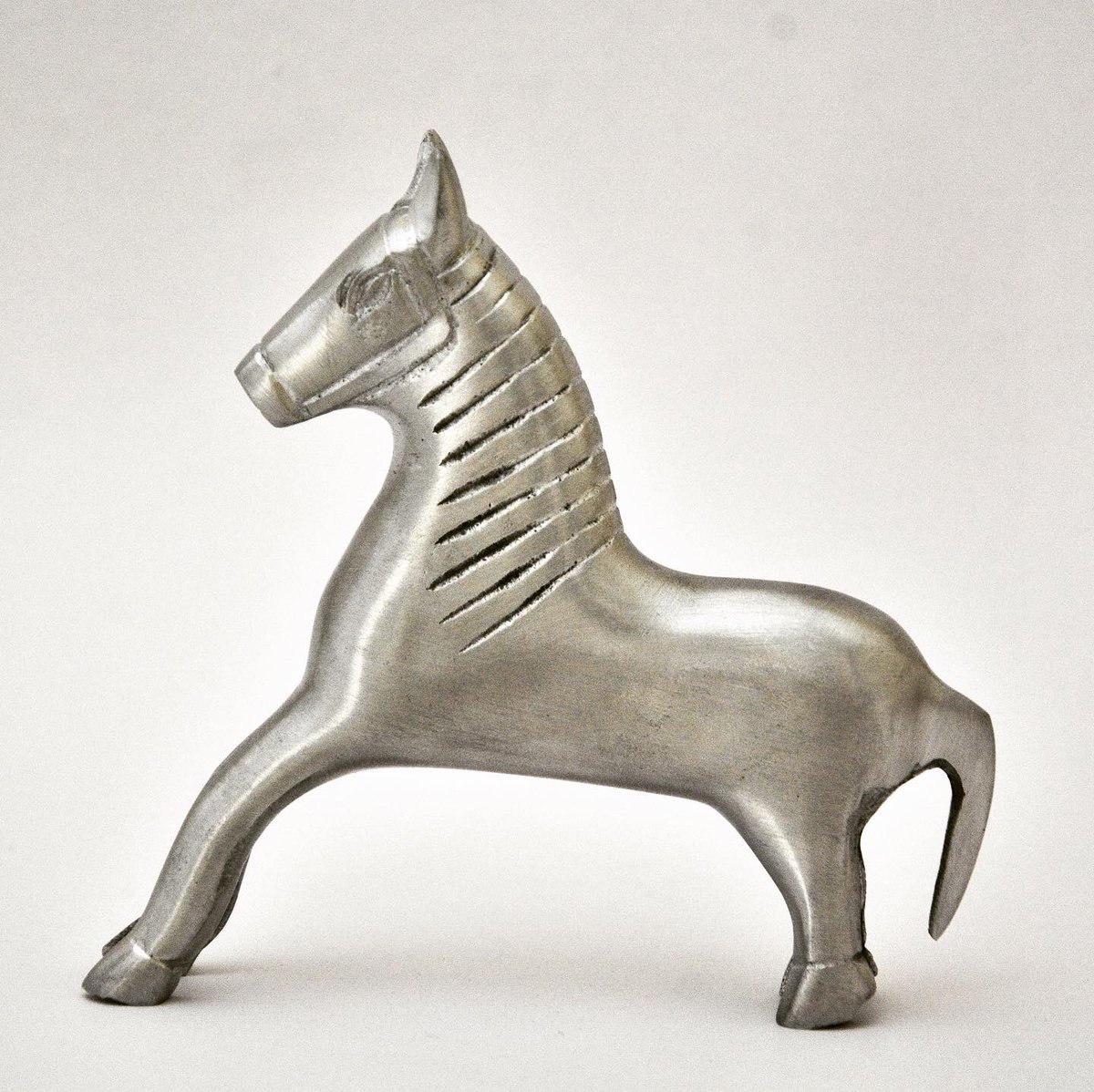 The Galloping Horse, takes inspiration from an artefact in the shape of a lock, dating back to the eighteenth century and found in the Indian subcontinent.
•
Numbered and signed edition of 27 pieces only.
Cast in Aluminium with a natural finish.