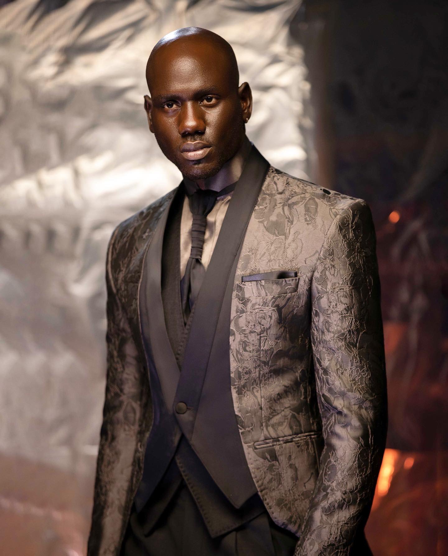 Deji Kola on X Look 3 The Lugard Tuxedo Suit Features A ruffled pattern Grey jacquard front closure tuxedo blazer suit Black Silk wide closure tie Dark grey silk