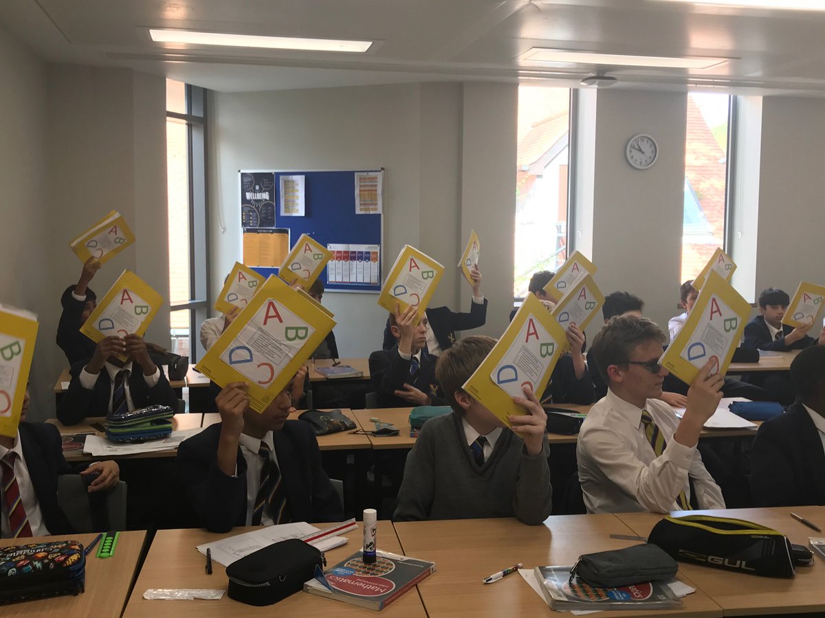 SASHerts's tweet image. This morning pupils in Mr. Arnold’s Mathematics class tested their knowledge by playing the ‘Checking for Understanding’ game. A question was put up on the board and the pupils chose which answer they believed was correct by holding up their notebooks to show A, B, C or D.