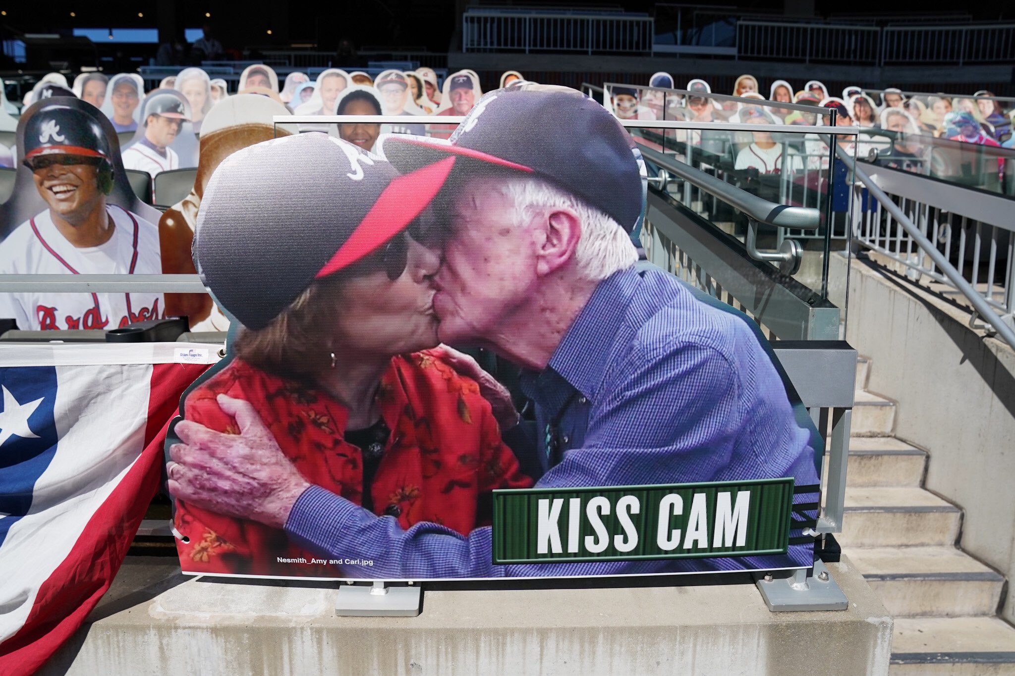 Atlanta Braves fan former President Jimmy Carter cheers during the seventh  inning stretch as a group sings God Bless America during Game 3 of the  National League Championship Series at Turner Field