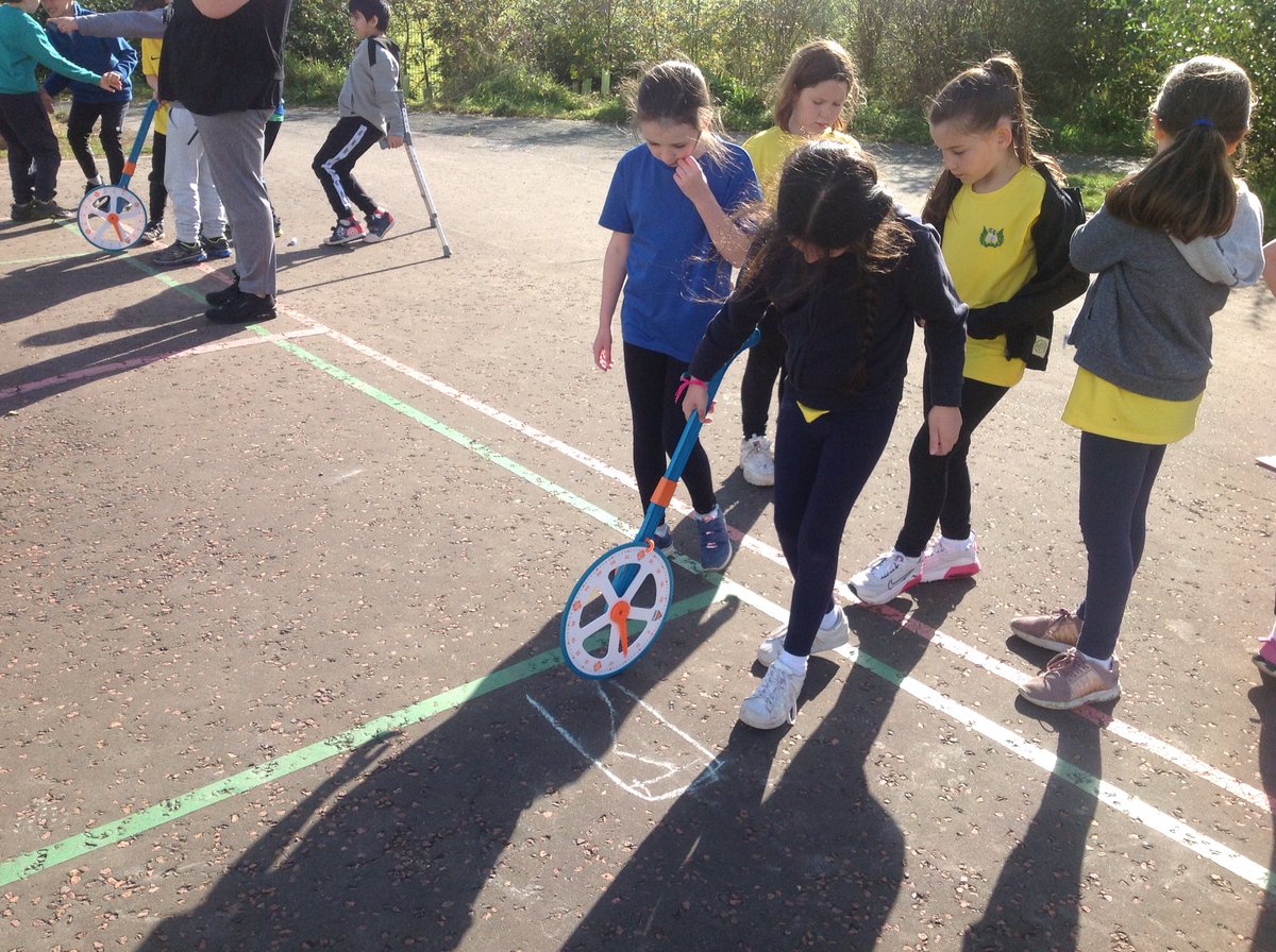 P4Calderwood's tweet photo. We celebrated #MathsWeekScot today with a maths ceilidh! We learned the Virginia Reel, then used the trundle wheels to measure how far we galloped. Next, we'll round these to the nearest 10cm and calculate the average distance galloped! #MathsWest #mathsscot #wp_education https://t.co/Zx2zrG7LN6