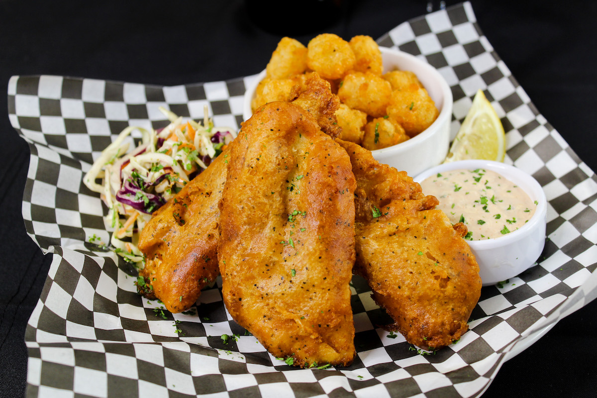 The most perfectly crispy and flavorful Alaskan Halibut Fish &amp; Tots!  
 
Beer battered and served with tater tots. citrus slaw. house remoulade.