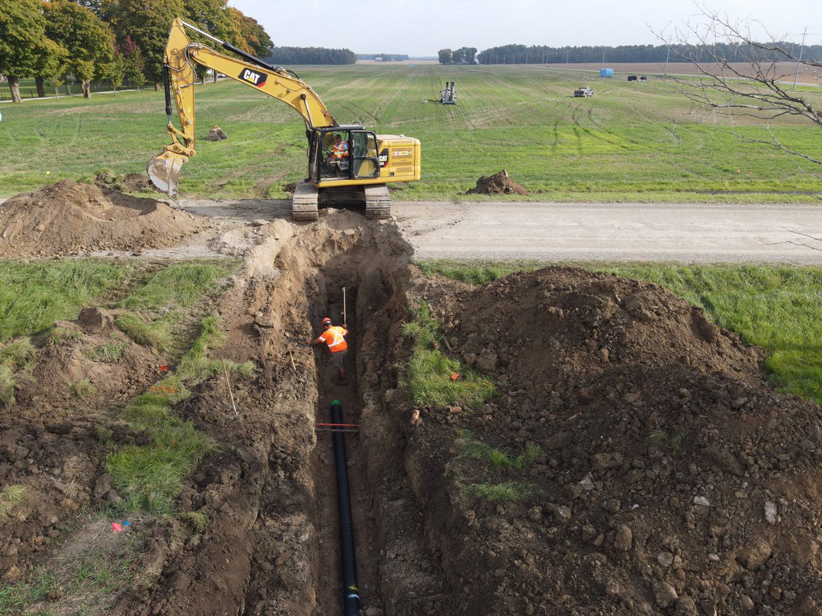 DrainageRoth's tweet photo. Quick little road crossing to have a better outlet upstream. We got under the fibre cable and gas line safely, and the guys did a great job getting the road back in shape 👍 https://t.co/coLbTFZa7q
