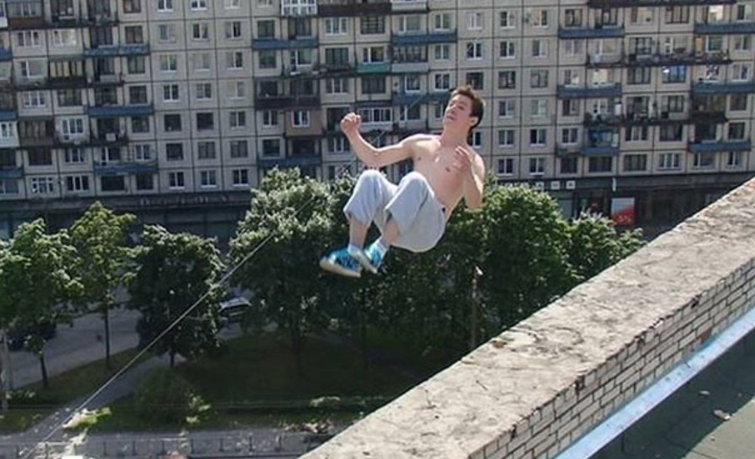 11)This photo shows parkour enthusiast Pavel Kashin performing the trick that'll lead to his death. He's pictured attempting to backflip to the wall but he'll soon loose his balance and fall to the ground below.(I respect the dead, but why would anyone do something so risky)