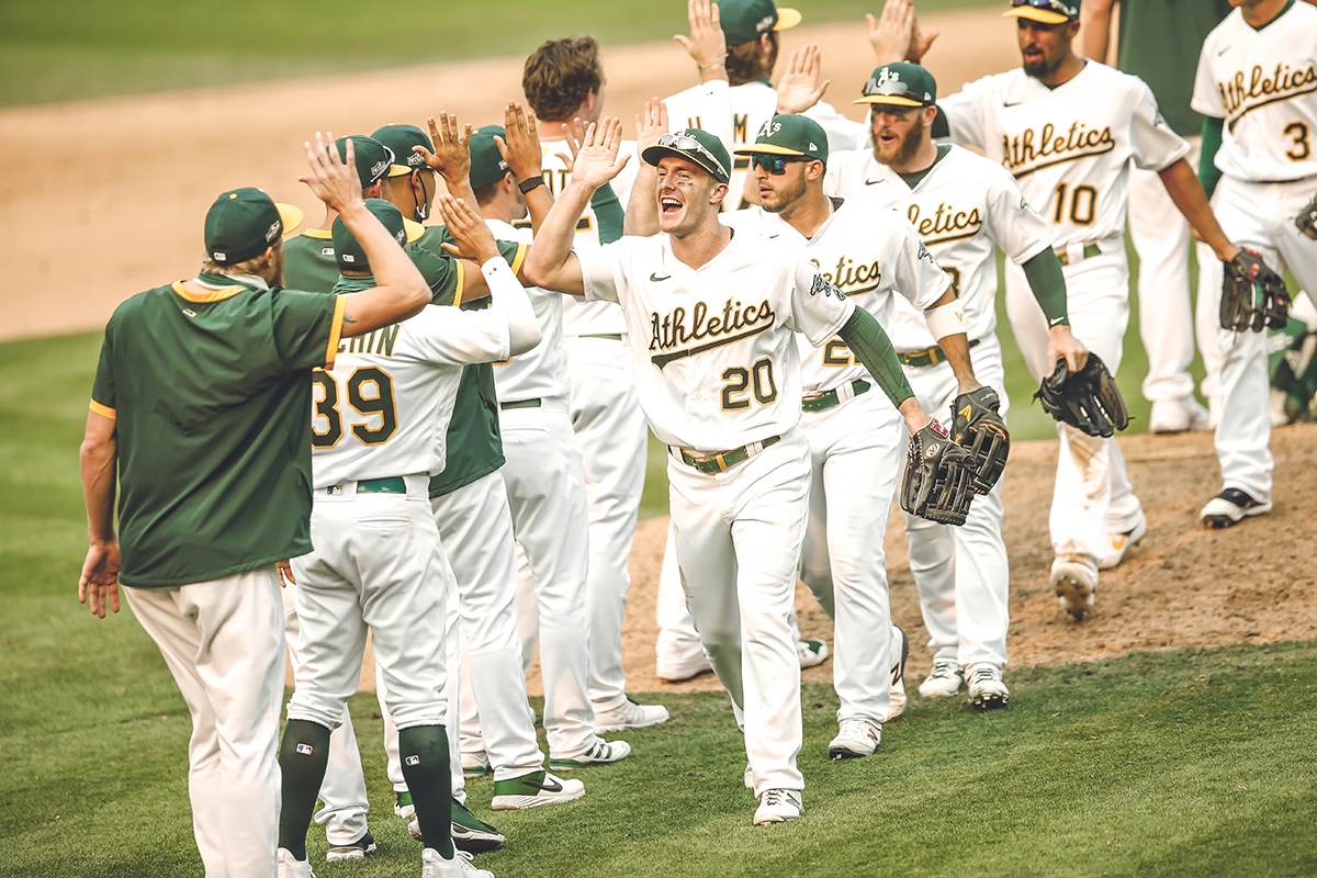 The A's celebrate their 6-4 win over the White Sox
