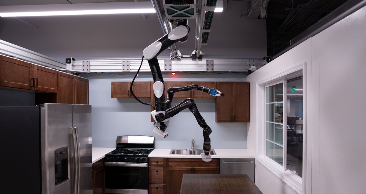 verge's tweet photo. Toyota’s robot butler prototype hangs from the ceiling like a bat https://t.co/tkp1jqusr8 https://t.co/O0dSFEtyT6