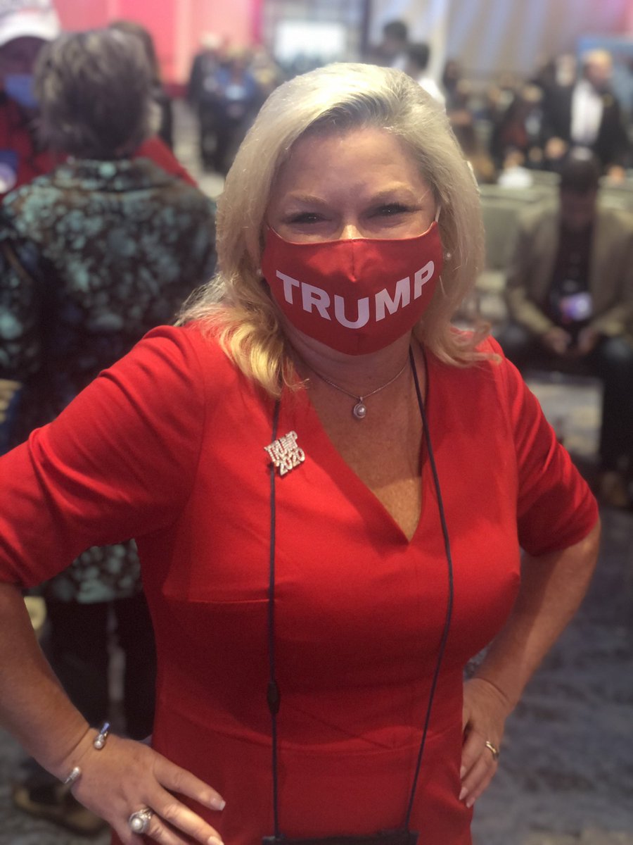 Marci McCarthy showed off her bright-red Trump mask, which she said she wears periodically. “It shows we are all able to contract COVID-19. And many of us can move forward and survive from it. I’m very confident President Trump and Melania will recover.”  #gapol – bei  Cobb Galleria Centre