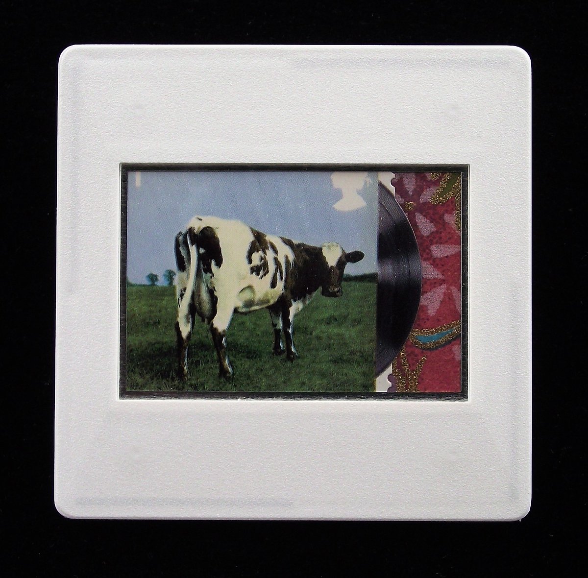 stamp_uk's tweet photo. It's fifty years today when ‘Atom Heart Mother’ by #PinkFloyd was released by Harvest Records in the UK. The image is of an upcycled, handmade postage stamp #brooch.  For more unique music badges, click https://t.co/ePFyCNCfaf https://t.co/xfgxcocoMc