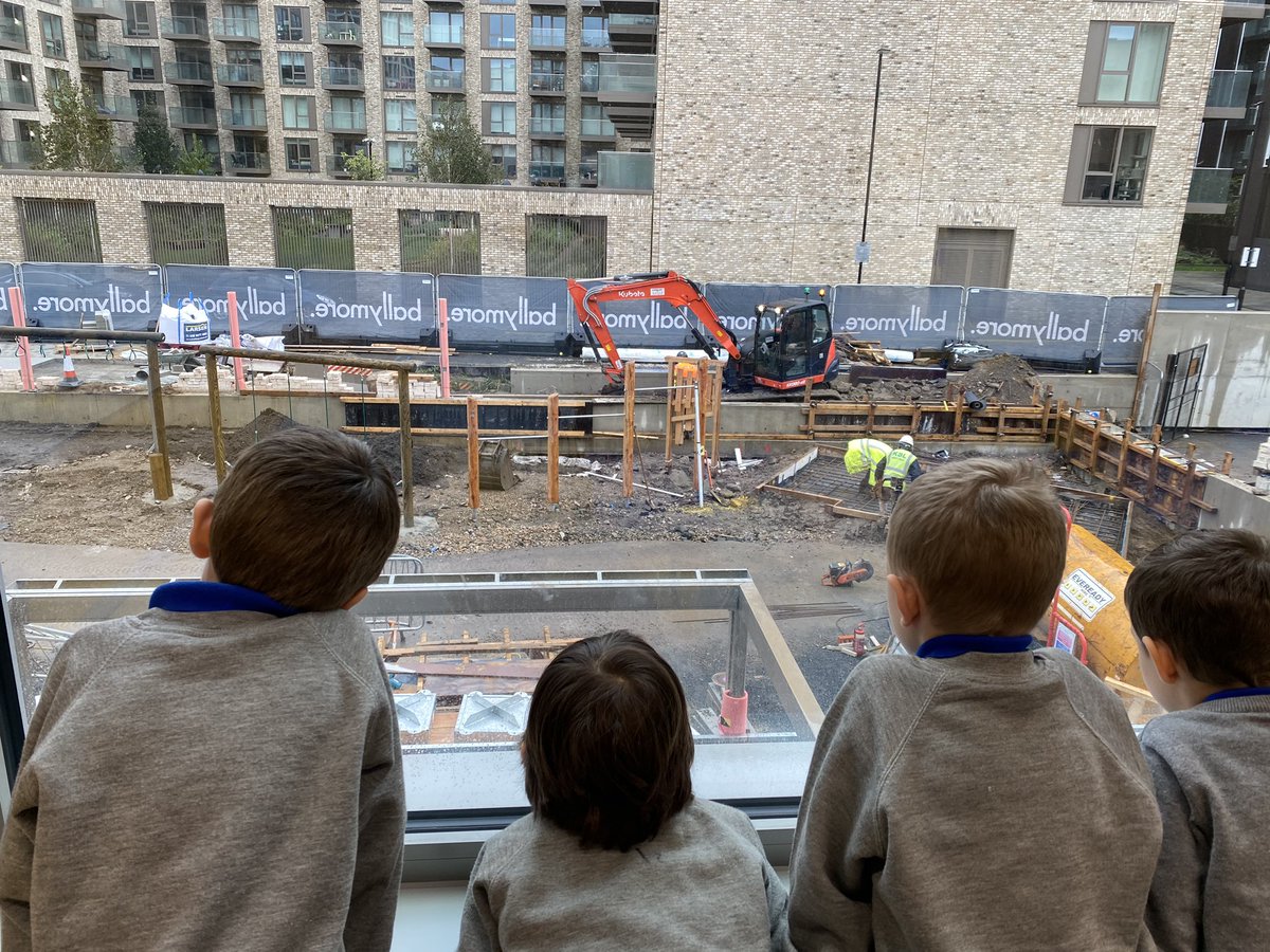 Our year 1 pupils are very excited watching the builders working on our new playground!