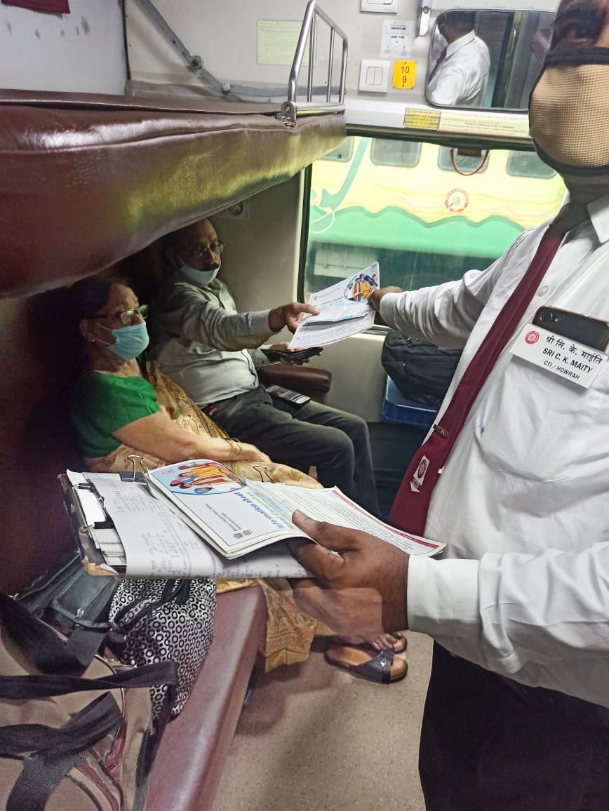 ER staff distributing IEC materials (pamphlets) among the passengers of  02301 Howrah-New Delhi AC Special Train to build awareness about COVID Appropriate Behaviour  to prevent the spread of COVID-19 . #IndiaFightsCorona