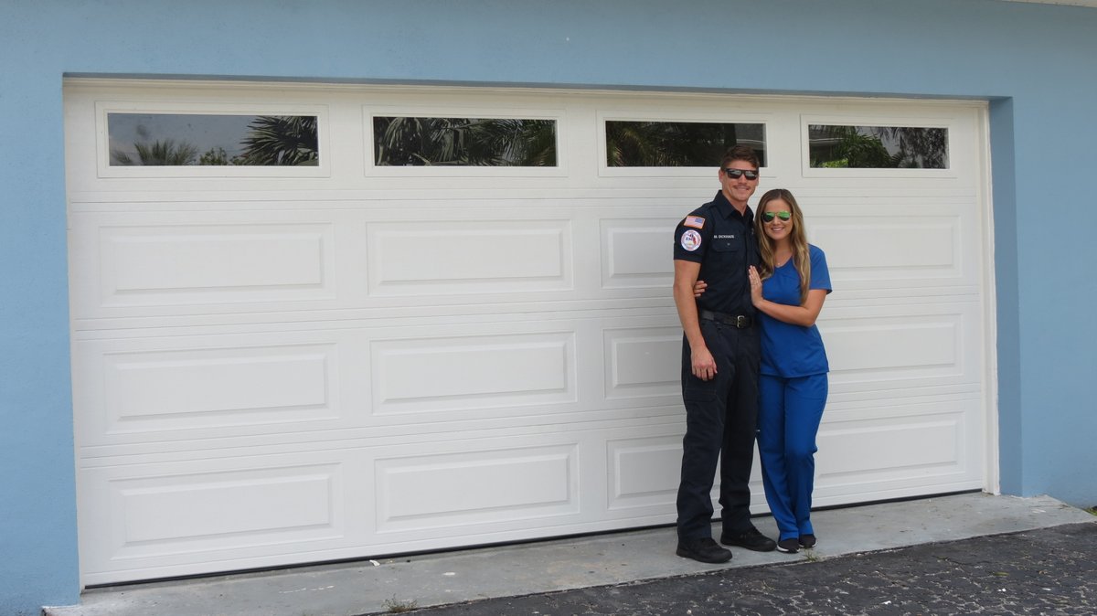 discountgarage's tweet photo. DGD is proud to help our first responders and medical heroes. We were honored to be able to donate and install a new garage door and opener for Matthew and Chrissy Dickhaus. Matthew is a firefighter/EMT and Chrissy is a nurse. We thank them very much for their service! https://t.co/LBMUQtivrU